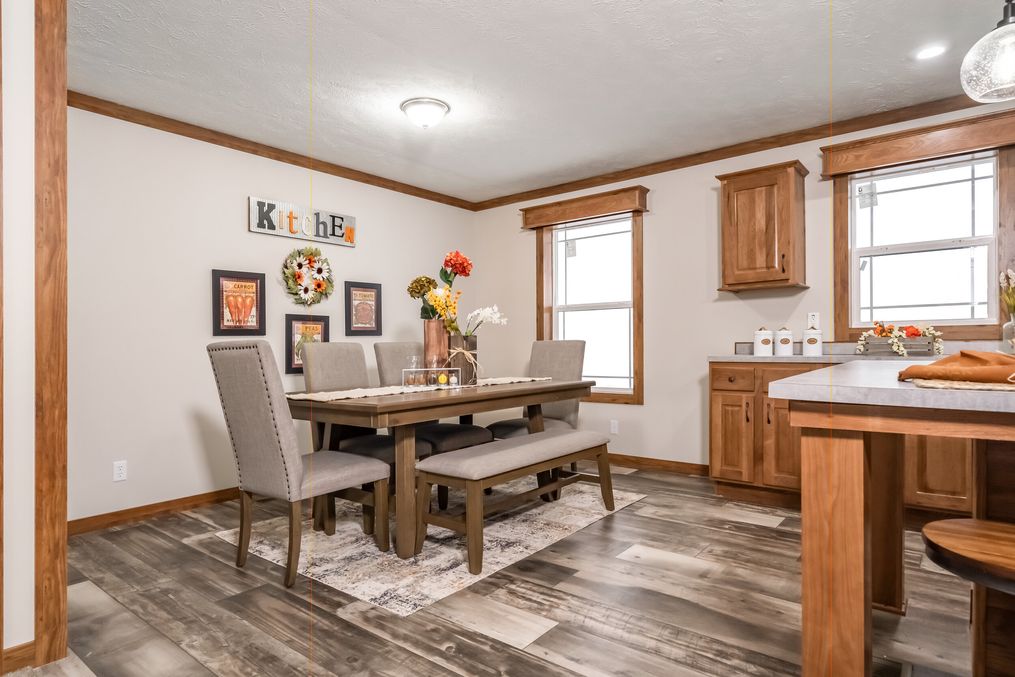 The CHEYENNE Dining Area. This Manufactured Mobile Home features 3 bedrooms and 2 baths.