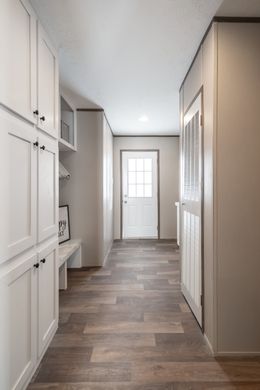 The FARMHOUSE BREEZE 72 Utility Room. This Manufactured Mobile Home features 4 bedrooms and 2 baths.