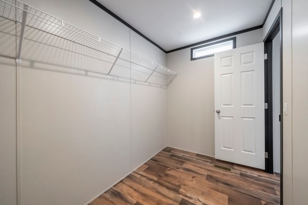 The RAVENWOOD Bedroom. This Manufactured Mobile Home features 3 bedrooms and 2 baths.