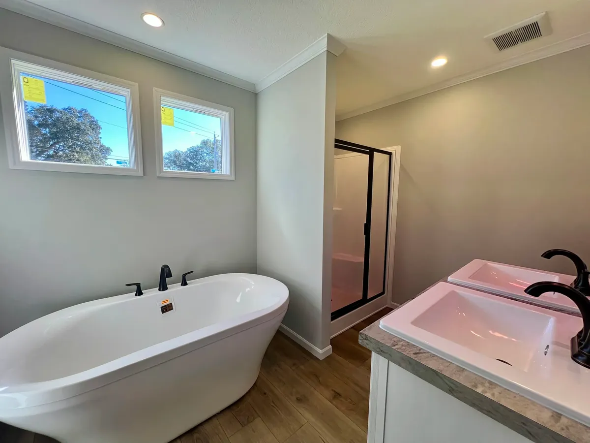 The THE TRUMAN Primary Bathroom. This Manufactured Mobile Home features 3 bedrooms and 2 baths.