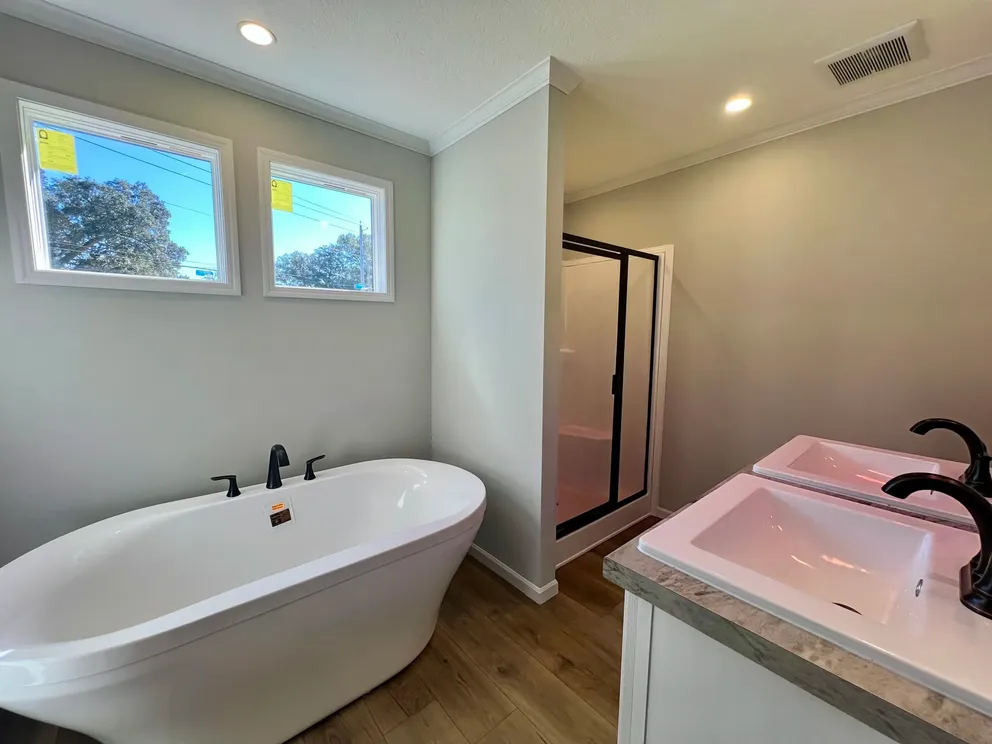 The THE TRUMAN Primary Bathroom. This Manufactured Mobile Home features 3 bedrooms and 2 baths.