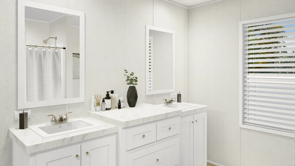 The GRAND LIVING 76 Guest Bathroom. This Manufactured Mobile Home features 4 bedrooms and 2 baths.