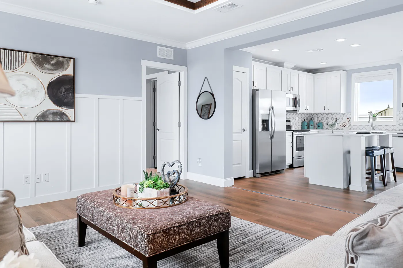 The THE ATLAS Living Room. This Manufactured Mobile Home features 4 bedrooms and 3 baths.