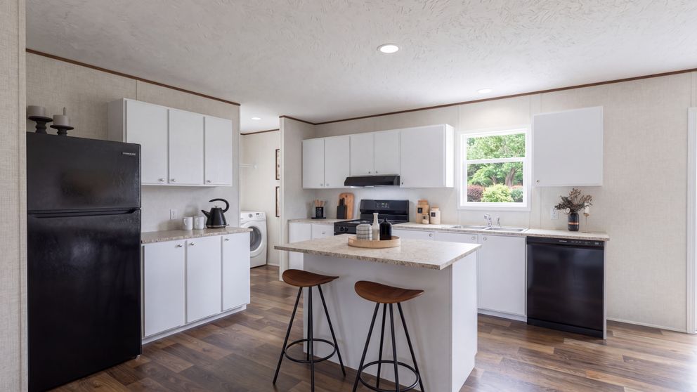 The SPRUCE Kitchen. This Manufactured Mobile Home features 3 bedrooms and 2 baths.