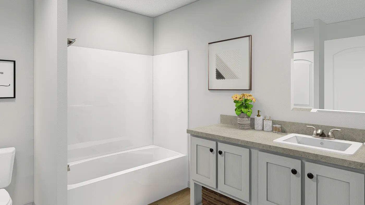 The ROCKET MAN Guest Bathroom. This Manufactured Mobile Home features 3 bedrooms and 2 baths.