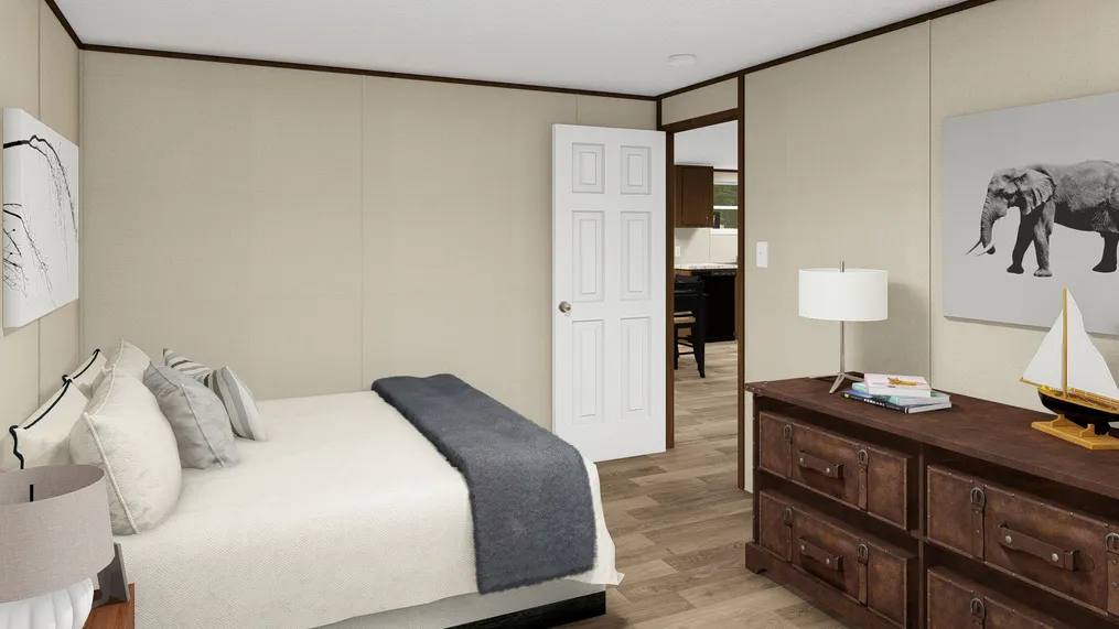 The SATISFACTION Bedroom. This Manufactured Mobile Home features 3 bedrooms and 2 baths.