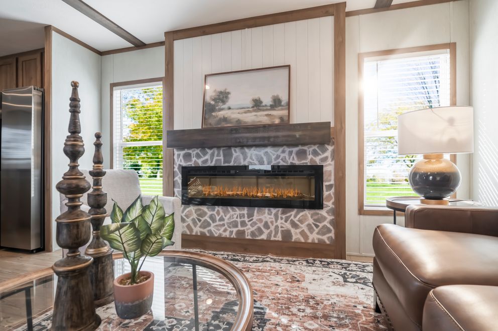 The SEAS THE DAY Living Room. This Manufactured Mobile Home features 3 bedrooms and 2 baths.