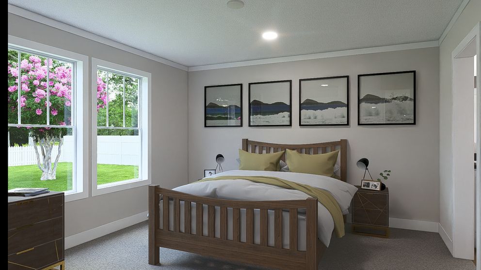 The BROWN EYED GIRL Primary Bedroom. This Manufactured Mobile Home features 4 bedrooms and 2 baths.