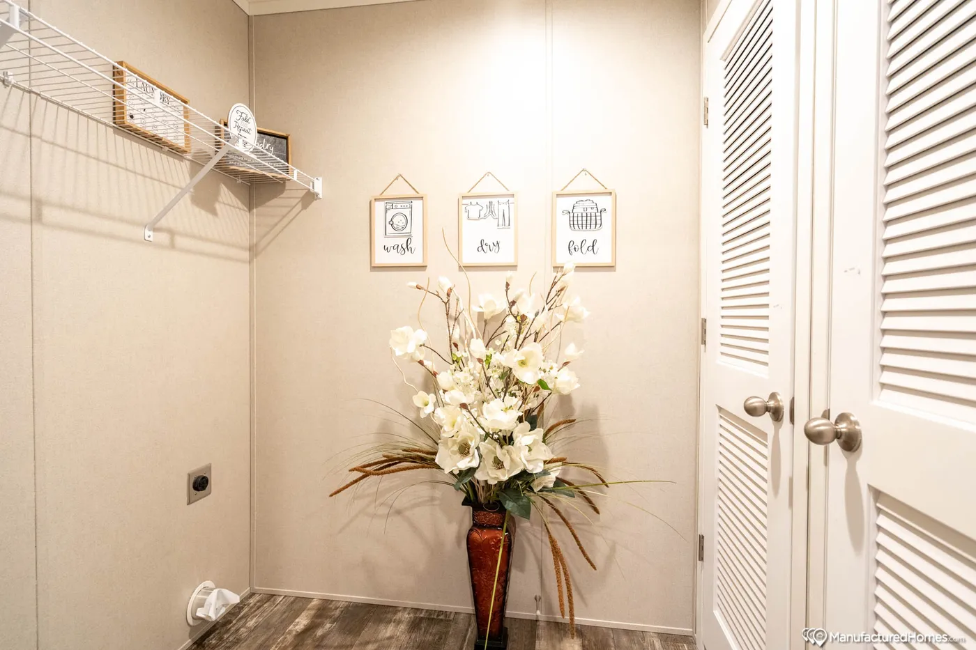 The TOPAZ 70 Utility Room. This Manufactured Mobile Home features 3 bedrooms and 2 baths.