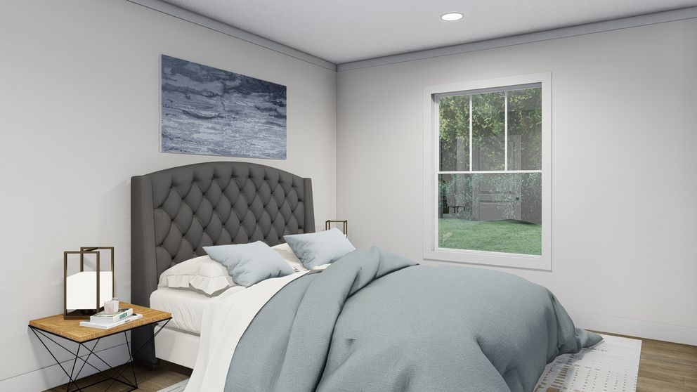 The BORN TO RUN Primary Bedroom. This Manufactured Mobile Home features 2 bedrooms and 2 baths.
