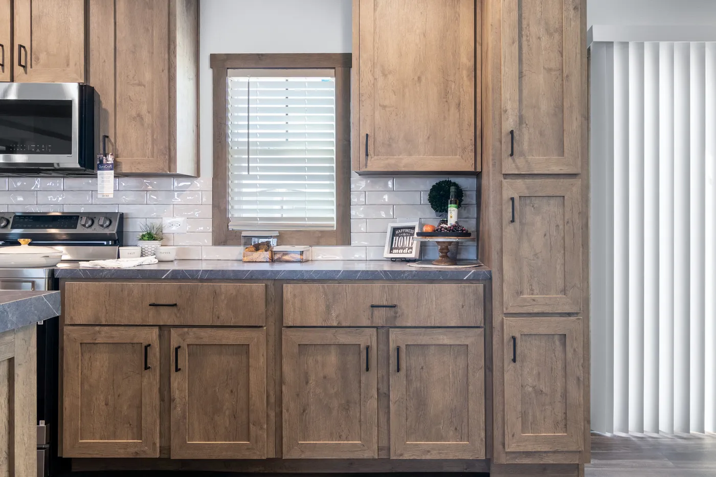 The ISABELLA ELITE Living Room. This Manufactured Mobile Home features 3 bedrooms and 2 baths.