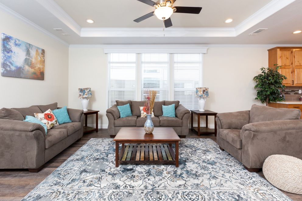 The SUM3076A Living Room. This Manufactured Mobile Home features 4 bedrooms and 2.5 baths.