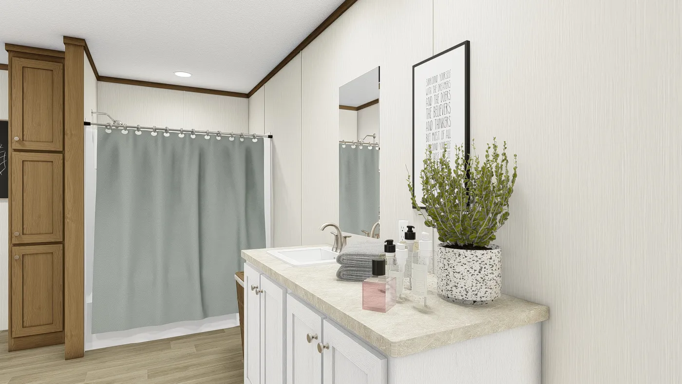 The THE EMPOWER Primary Bathroom. This Manufactured Mobile Home features 4 bedrooms and 2 baths.