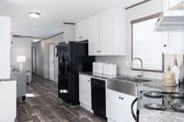 The THE SHOWER HOUSE 2.0 Kitchen. This Manufactured Mobile Home features 3 bedrooms and 2 baths.
