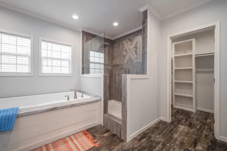 The THE HEWITT Primary Bathroom. This Manufactured Mobile Home features 4 bedrooms and 3 baths.