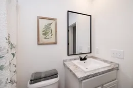 The THE ANNA FAE Guest Bathroom. This Manufactured Mobile Home features 3 bedrooms and 2 baths.