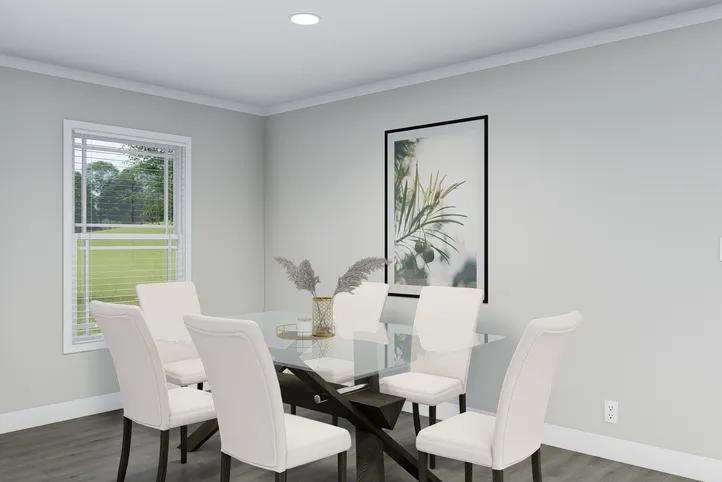 The THE BREEZE Dining Room. This Manufactured Mobile Home features 3 bedrooms and 2 baths.