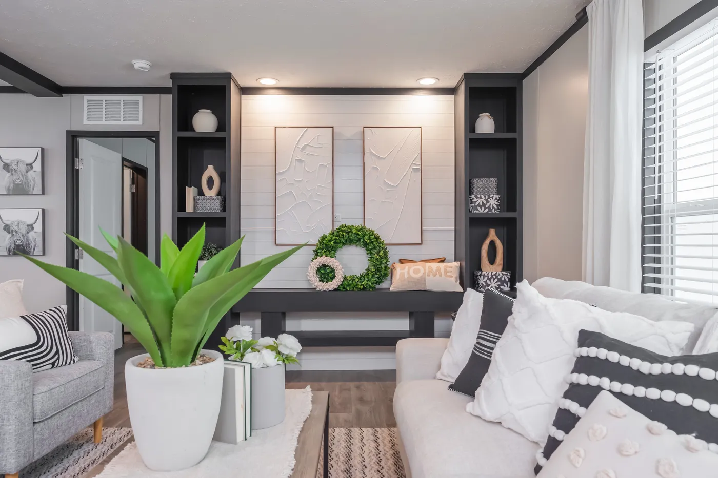 The CRAZY EIGHTS Living Room. This Manufactured Mobile Home features 4 bedrooms and 2 baths.