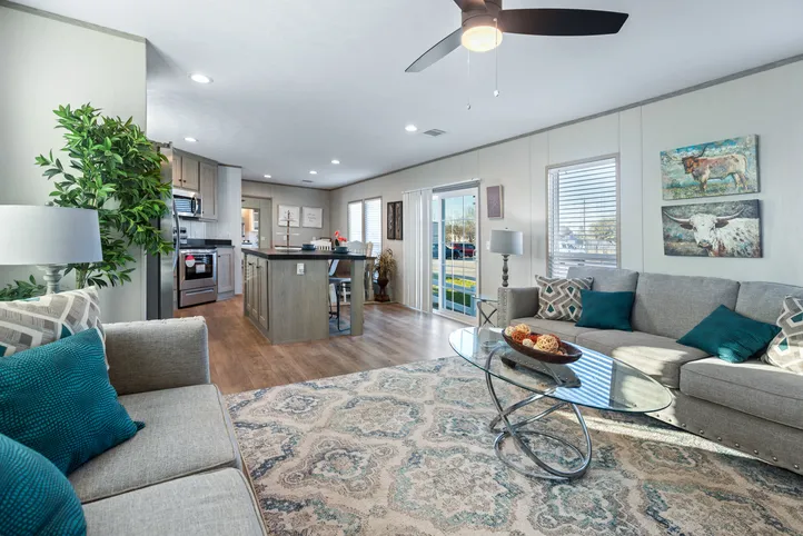 The RESOLUTION 16763J Living Room. This Manufactured Mobile Home features 3 bedrooms and 2 baths.
