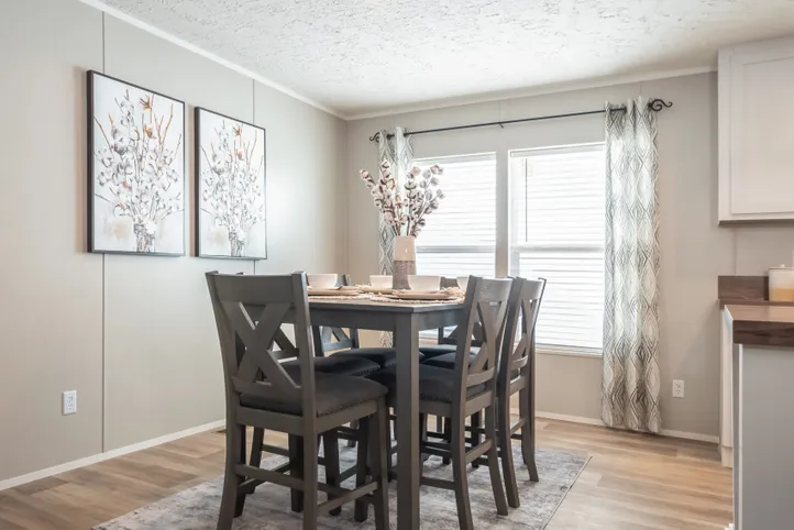 The TRADITION 2868B Dining Area. This Manufactured Mobile Home features 4 bedrooms and 2 baths.