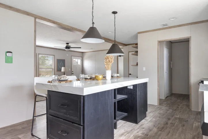 The STERLING XL ANNIVERSARY Kitchen. This Manufactured Mobile Home features 3 bedrooms and 2 baths.