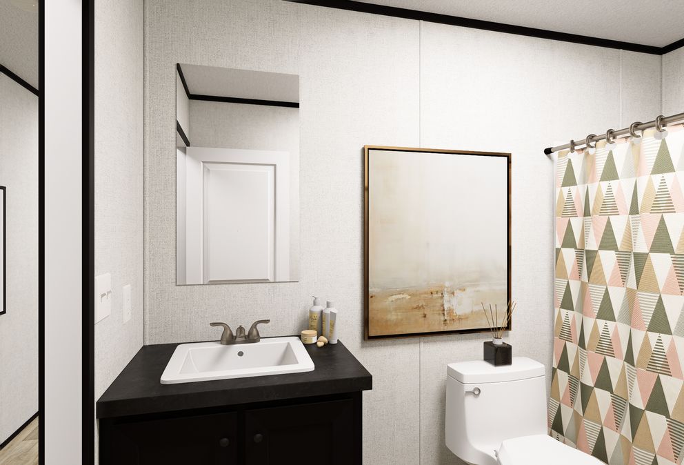 The ECLIPSE Guest Bathroom. This Manufactured Mobile Home features 4 bedrooms and 2 baths.
