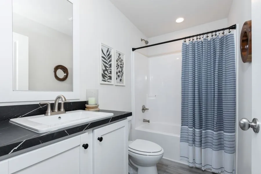 The BUTLER PLACE/6428-MS056 SECT Guest Bathroom. This Manufactured Mobile Home features 3 bedrooms and 3 baths.
