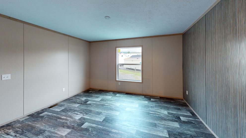 The FRANKLIN Primary Bedroom. This Manufactured Mobile Home features 3 bedrooms and 2 baths.