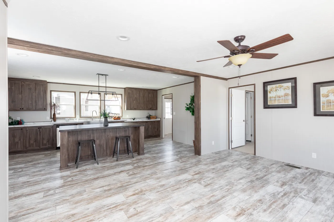 The LEWIS Living Room. This Manufactured Mobile Home features 3 bedrooms and 2 baths.