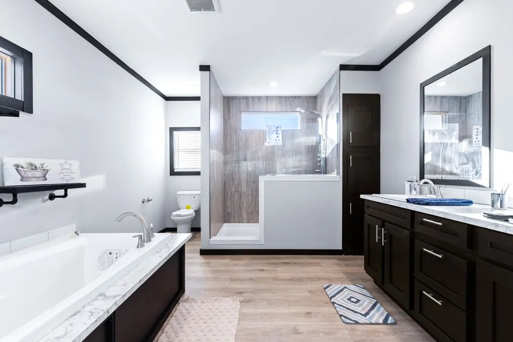 The THE LOUIS Primary Bathroom. This Manufactured Mobile Home features 4 bedrooms and 3 baths.
