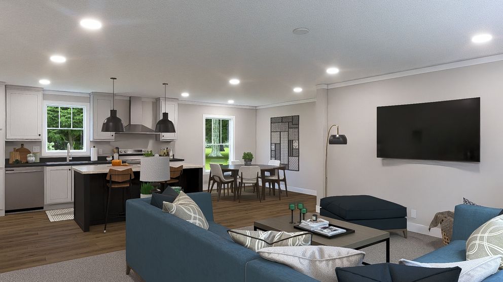The WONDERFUL WORLD Living Room. This Manufactured Mobile Home features 3 bedrooms and 2 baths.