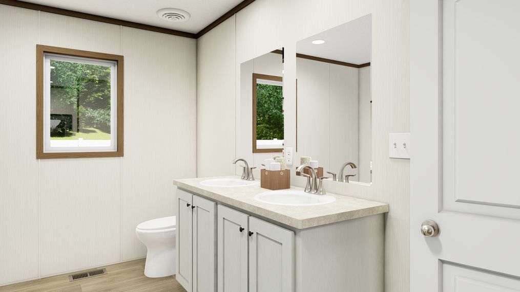 The COLOSSAL Primary Bathroom. This Manufactured Mobile Home features 3 bedrooms and 2 baths.