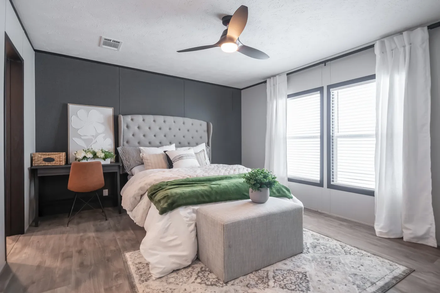 The CRAZY EIGHTS Primary Bedroom. This Manufactured Mobile Home features 4 bedrooms and 2 baths.