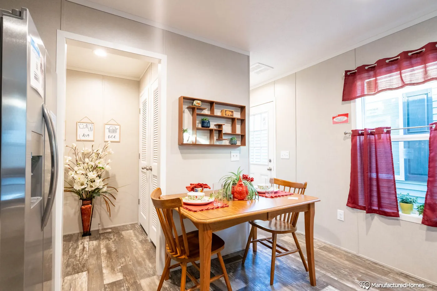 The TOPAZ 70 Dining Area. This Manufactured Mobile Home features 3 bedrooms and 2 baths.