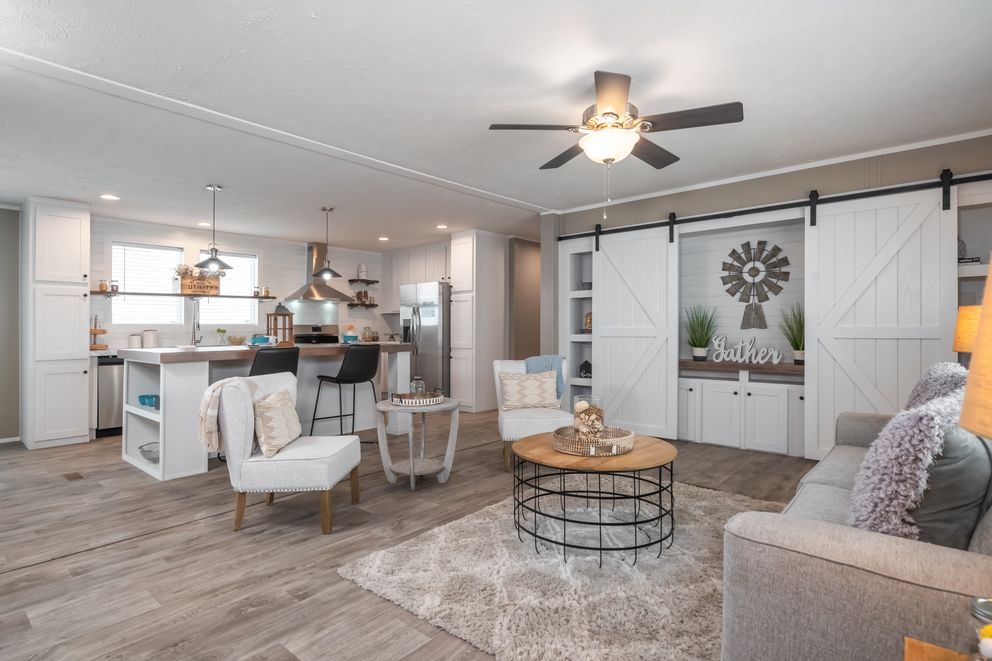 The THE RESERVE 60 Living Room. This Manufactured Mobile Home features 3 bedrooms and 2 baths.