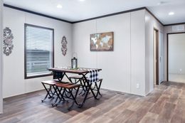 The BREEZE FARMHOUSE Dining Room. This Manufactured Mobile Home features 3 bedrooms and 2 baths.