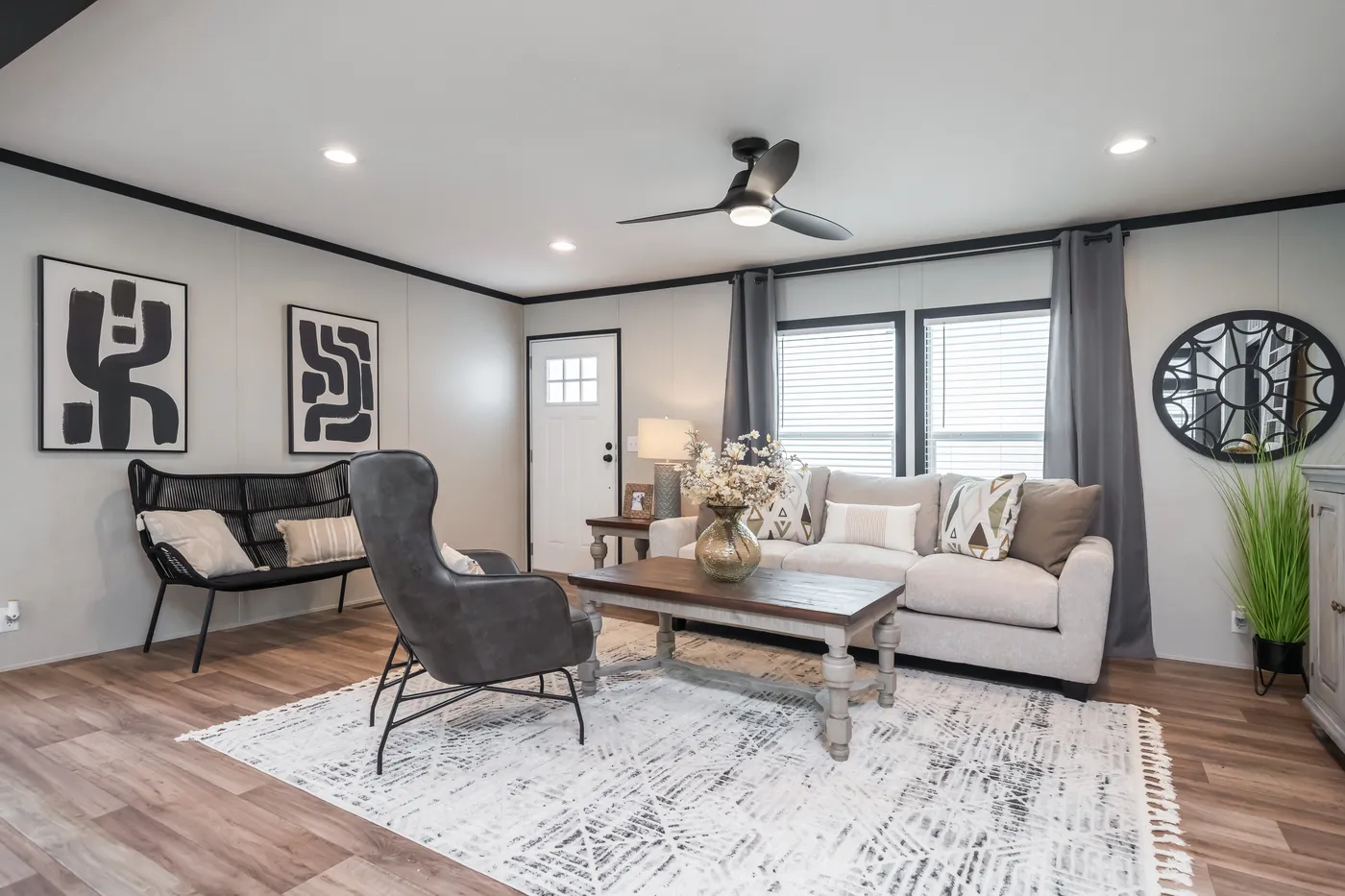 The ABSOLUTE VALUE Living Room. This Manufactured Mobile Home features 4 bedrooms and 2 baths.