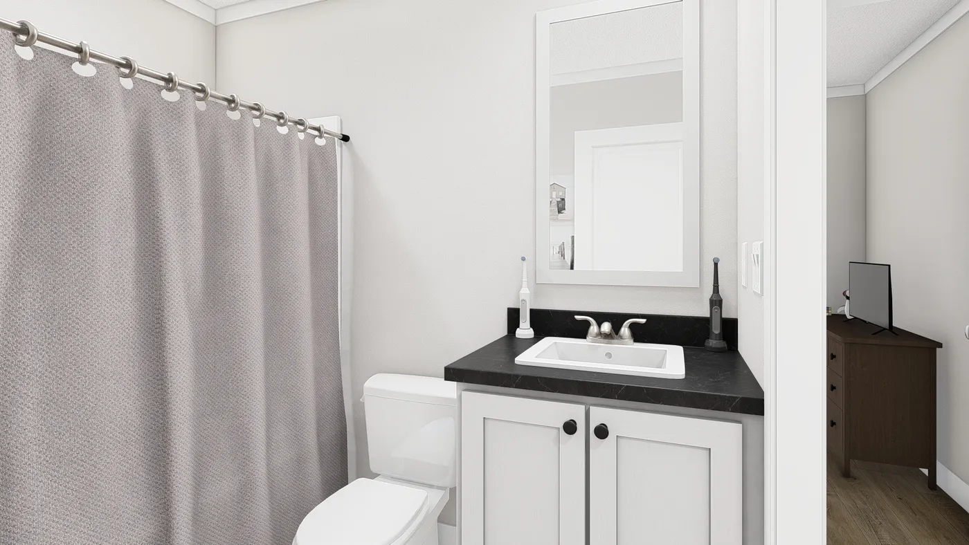 The RHYTHM NATION Guest Bathroom. This Manufactured Mobile Home features 3 bedrooms and 2 baths.