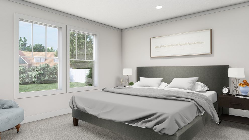 The ROCKET MAN Primary Bedroom. This Manufactured Mobile Home features 3 bedrooms and 2 baths.