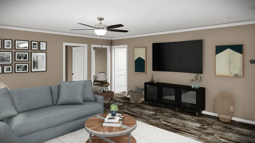 The THE MAVERICK Living Room. This Manufactured Mobile Home features 3 bedrooms and 2 baths.