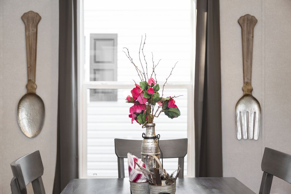 The SAPPHIRE Dining Room. This Manufactured Mobile Home features 3 bedrooms and 2 baths.