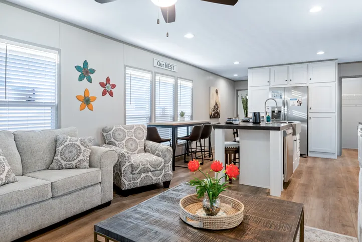 The RESOLUTION 16763X Living Room. This Manufactured Mobile Home features 3 bedrooms and 2 baths.