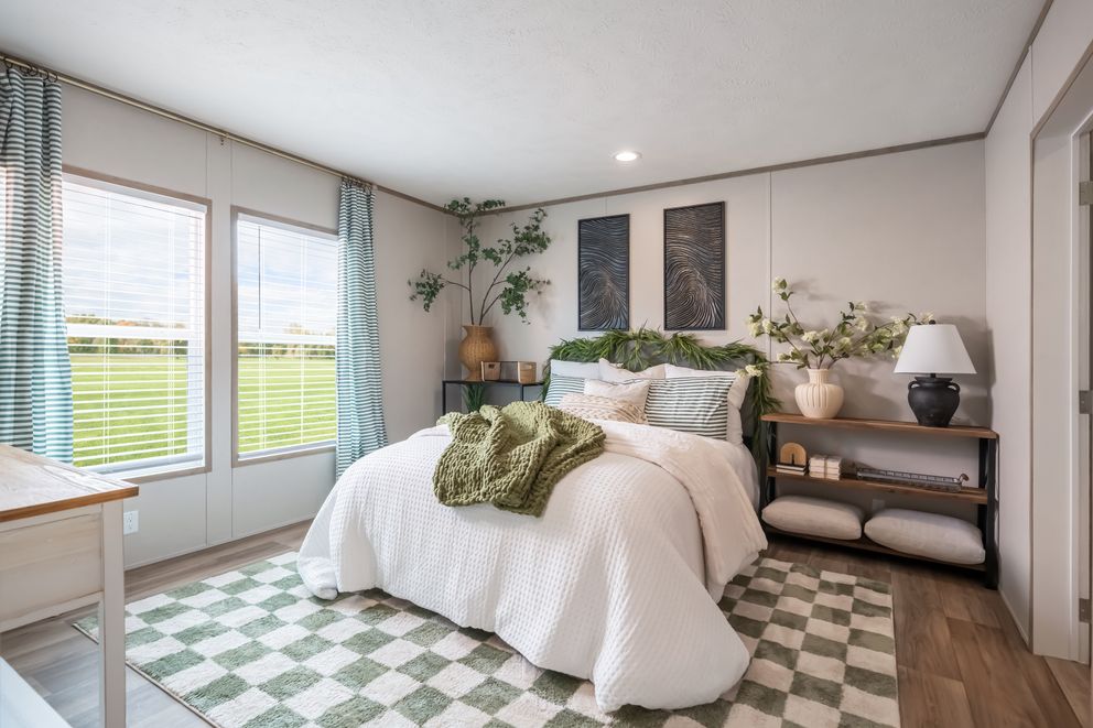 The VISTA Primary Bedroom. This Manufactured Mobile Home features 3 bedrooms and 2 baths.