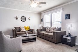 The TUCSON Living Room. This Manufactured Mobile Home features 3 bedrooms and 2 baths.