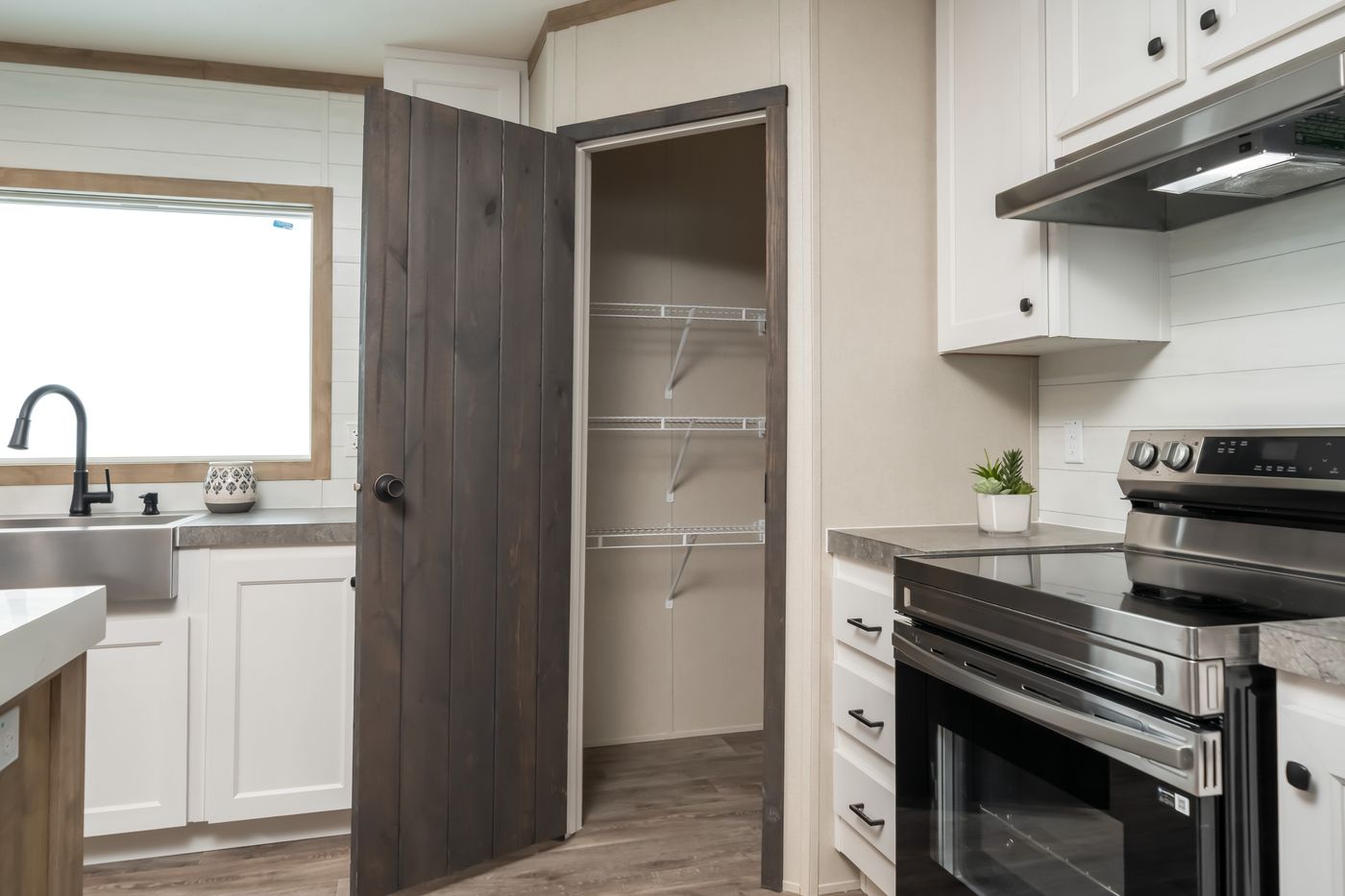 The PT 78 Kitchen. This Manufactured Mobile Home features 3 bedrooms and 2 baths.