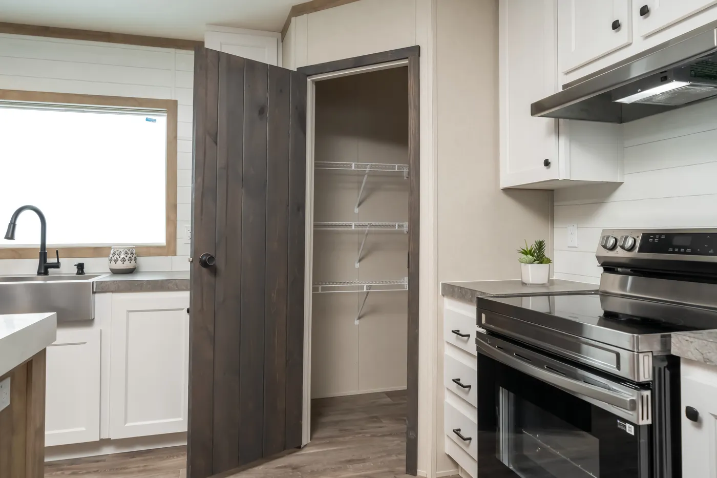 The PT 78 Kitchen. This Manufactured Mobile Home features 3 bedrooms and 2 baths.