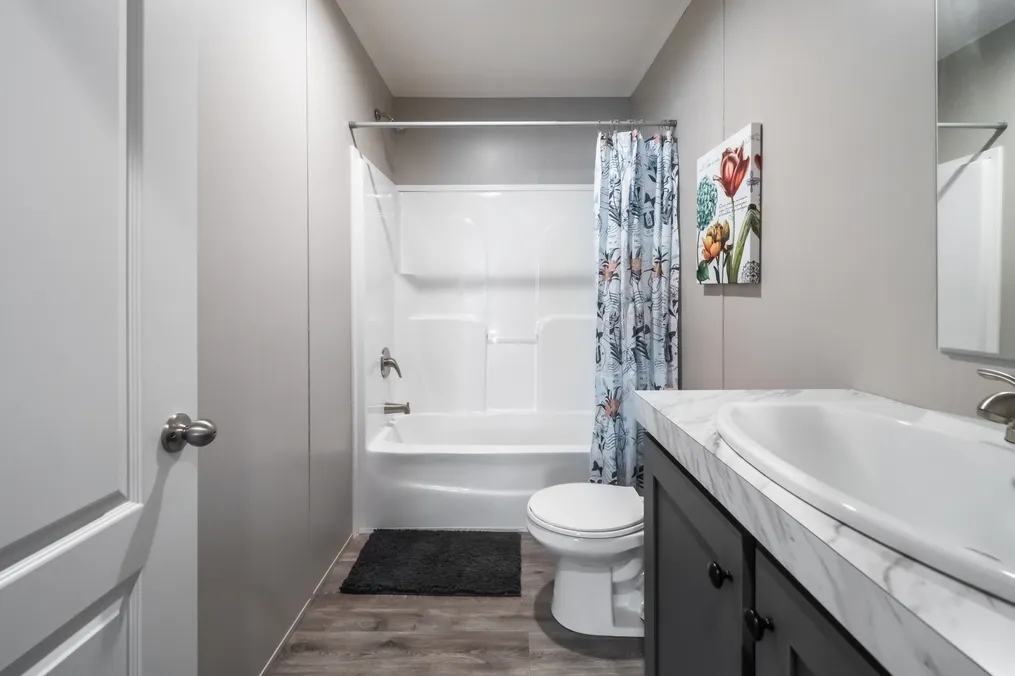 The THE EAGLE 60 Guest Bathroom. This Manufactured Mobile Home features 3 bedrooms and 2 baths.