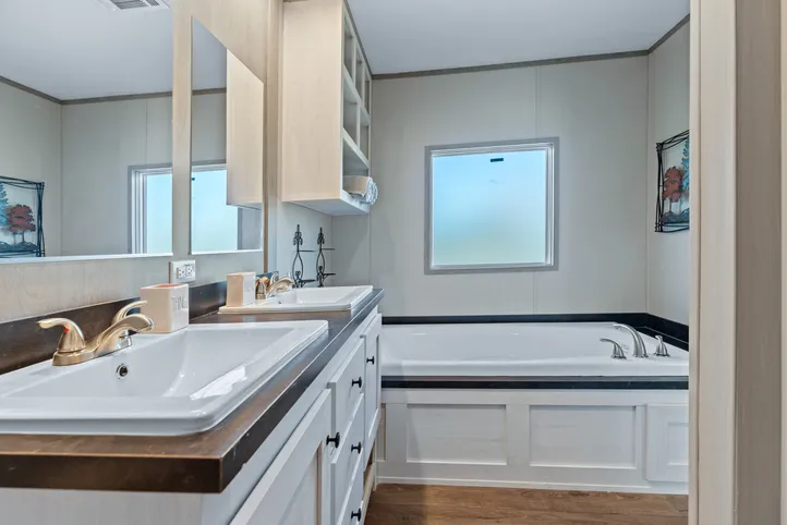 The RESOLUTION 16763J Primary Bathroom. This Manufactured Mobile Home features 3 bedrooms and 2 baths.