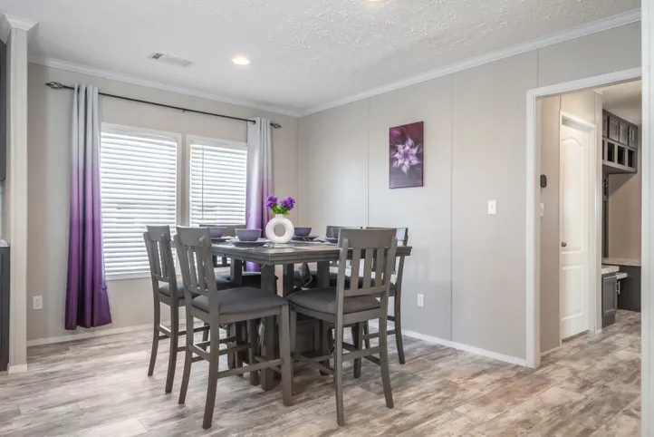 The STELLA Dining Room. This Manufactured Mobile Home features 3 bedrooms and 2 baths.