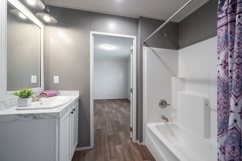 The TRADITION 3268B Guest Bathroom. This Manufactured Mobile Home features 5 bedrooms and 3 baths.